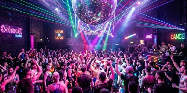 SchwuZ Berlin queer club dancefloor - colorful pop party vibe and laser lights