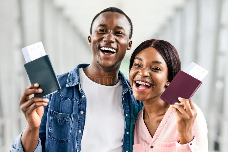 Happy gay couple at the airport ready for a comfortable and inclusive European flight