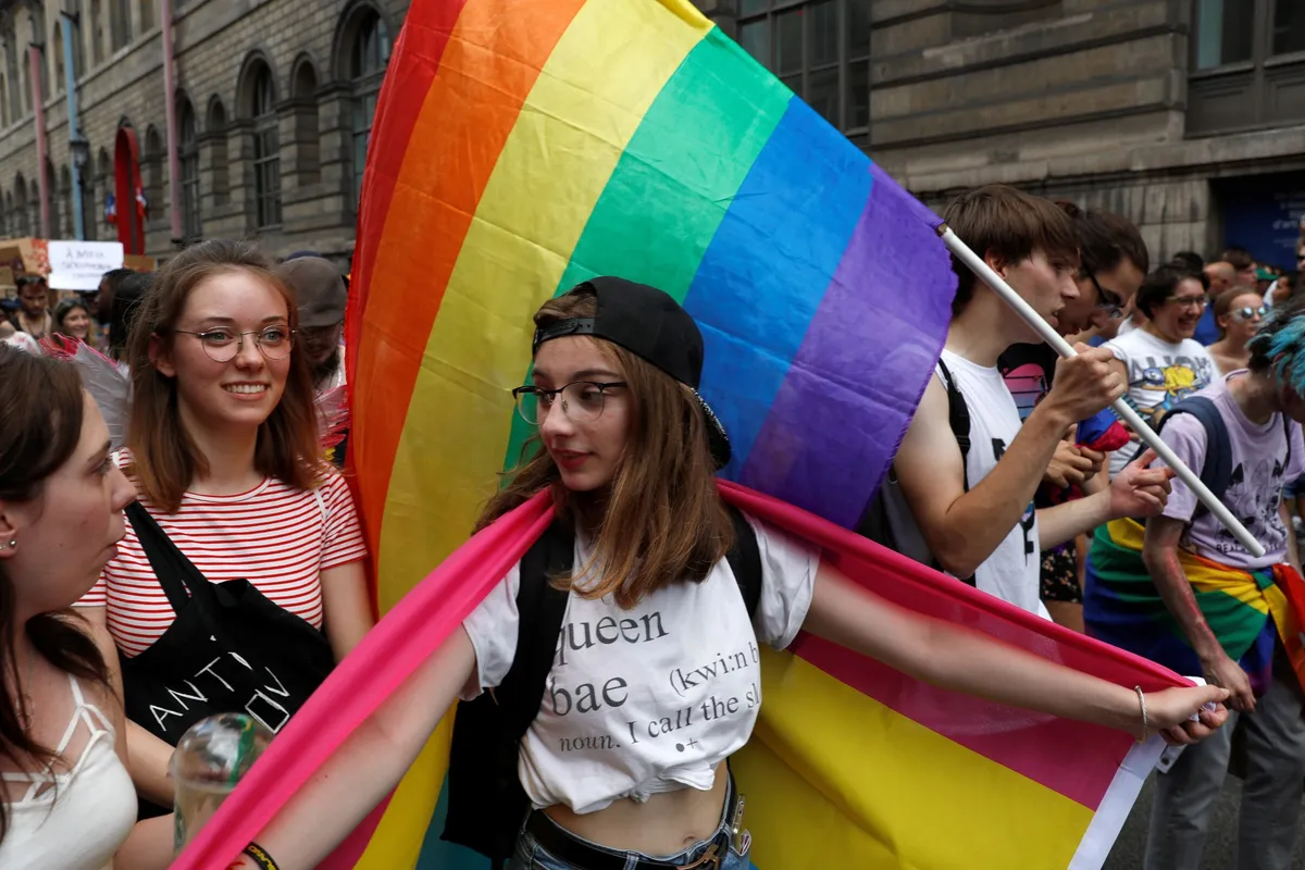 Paris Marche des Fiertes - colorful pride parade marching through the fashion capital