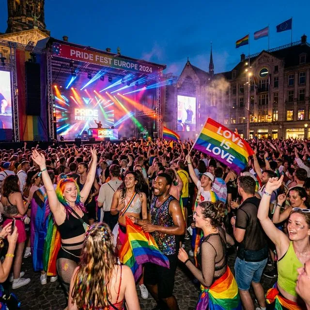 Vibrant Pride street party in Europe - people dancing and celebrating in the sun
