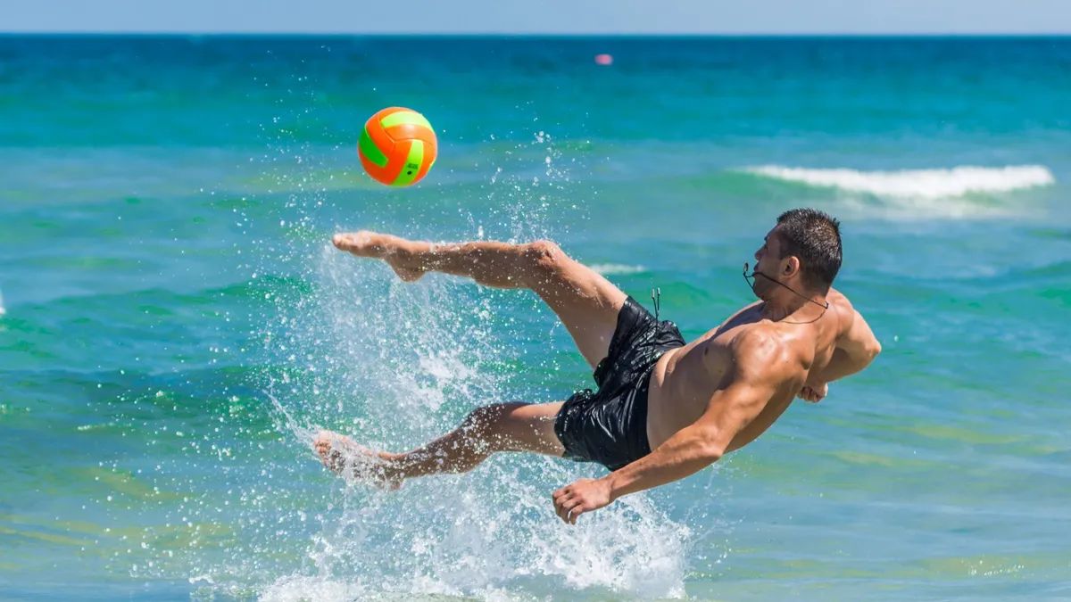 Torremolinos gay beach near Málaga - sun-seekers and rainbow flags on Costa del Sol